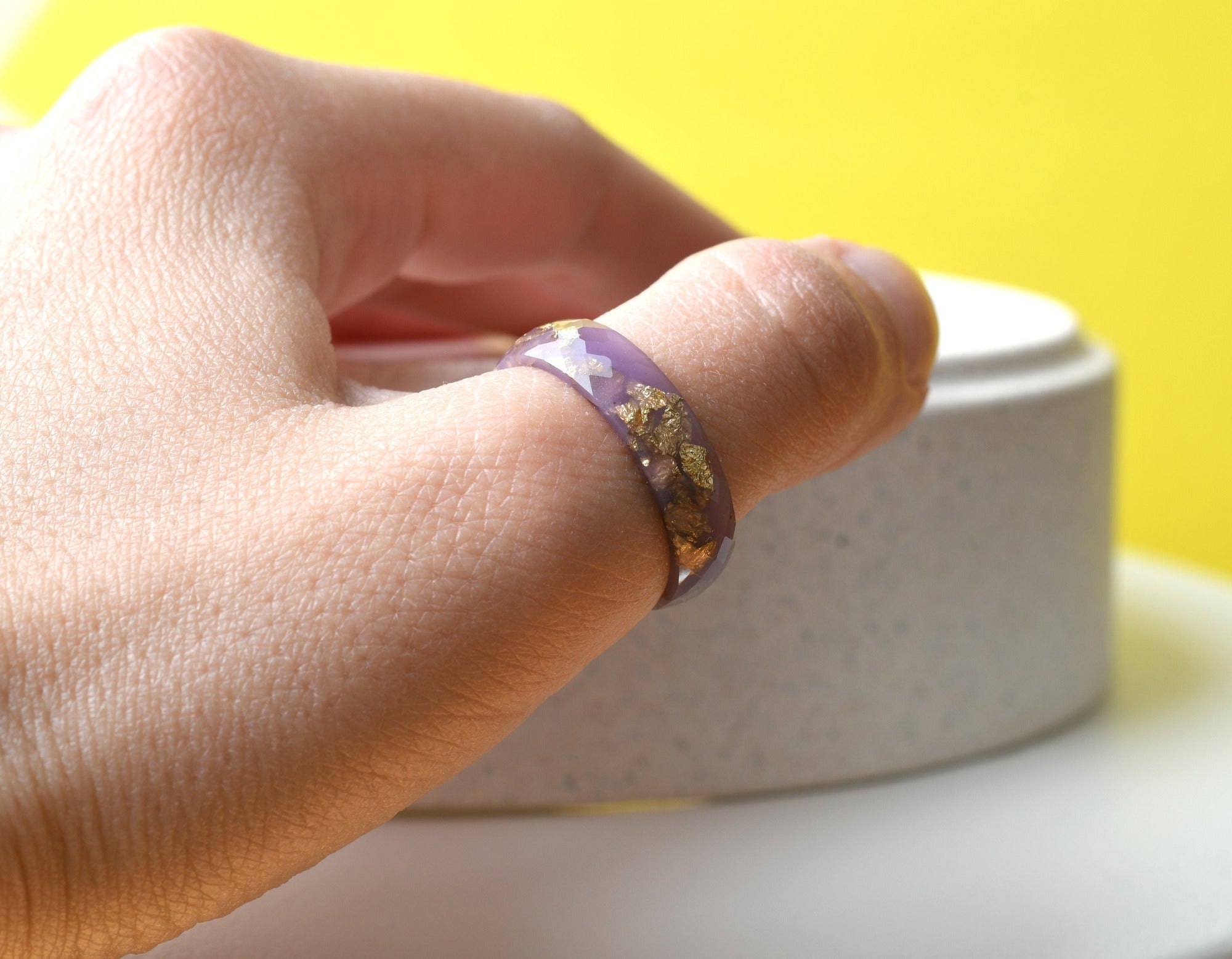 Stack of pastel resin rings worn on hand — minimalist everyday jewelry