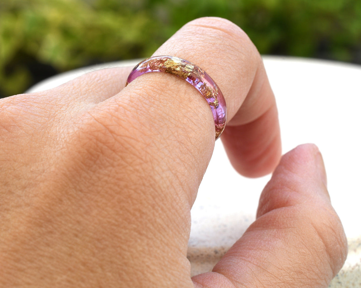 Peony pink resin ring worn on hand — delicate everyday jewelry