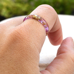 Peony pink resin ring worn on hand — delicate everyday jewelry