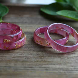 side view of pink resin ring with gold leaf – one-of-a-kind piece