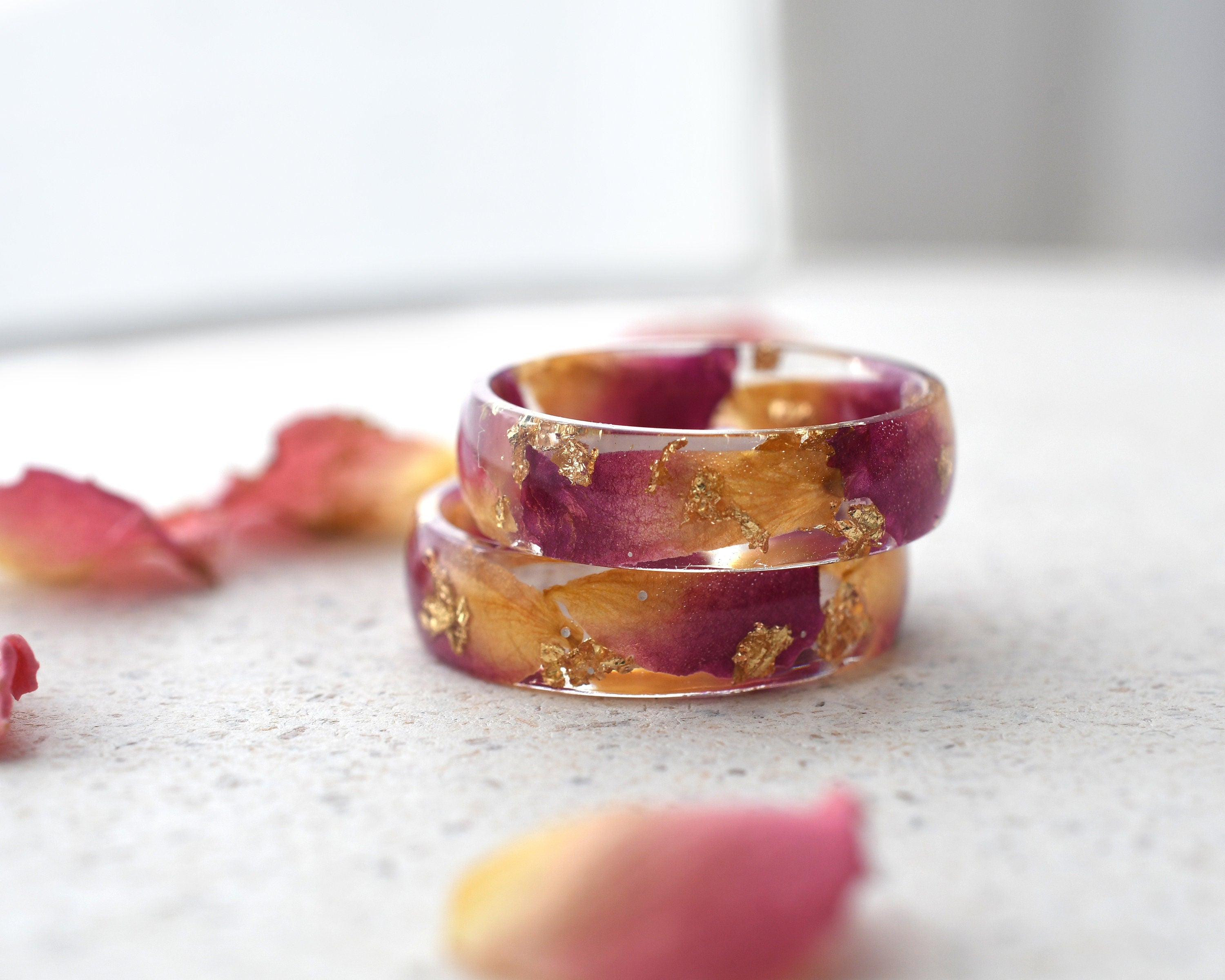 Rose Bloom Ring stacked with other rings, showing its compatibility and beauty in sets