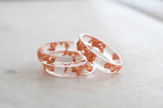 Transparent resin ring with rose gold flakes