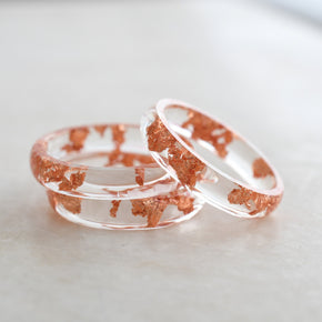 Transparent resin ring with rose gold flakes