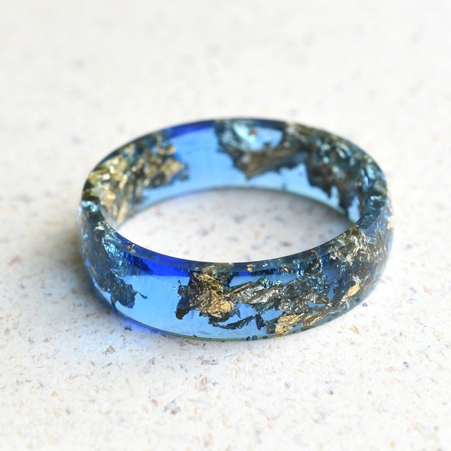 Sapphire blue resin ring with gold leaf handmade by Resity in Vienna