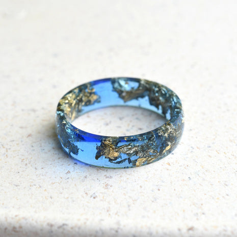 Sapphire blue resin ring with gold leaf handmade by Resity in Vienna