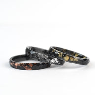 Minimalist black resin ring for men and women with customizable metallic leaf options
