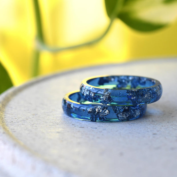 Close-up of real silver flakes in navy resin band
