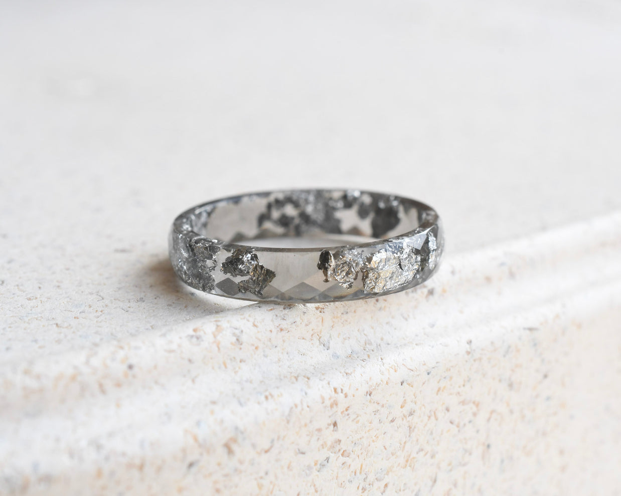 Slim faceted grey resin stacking ring with metallic silver flakes handmade in Vienna