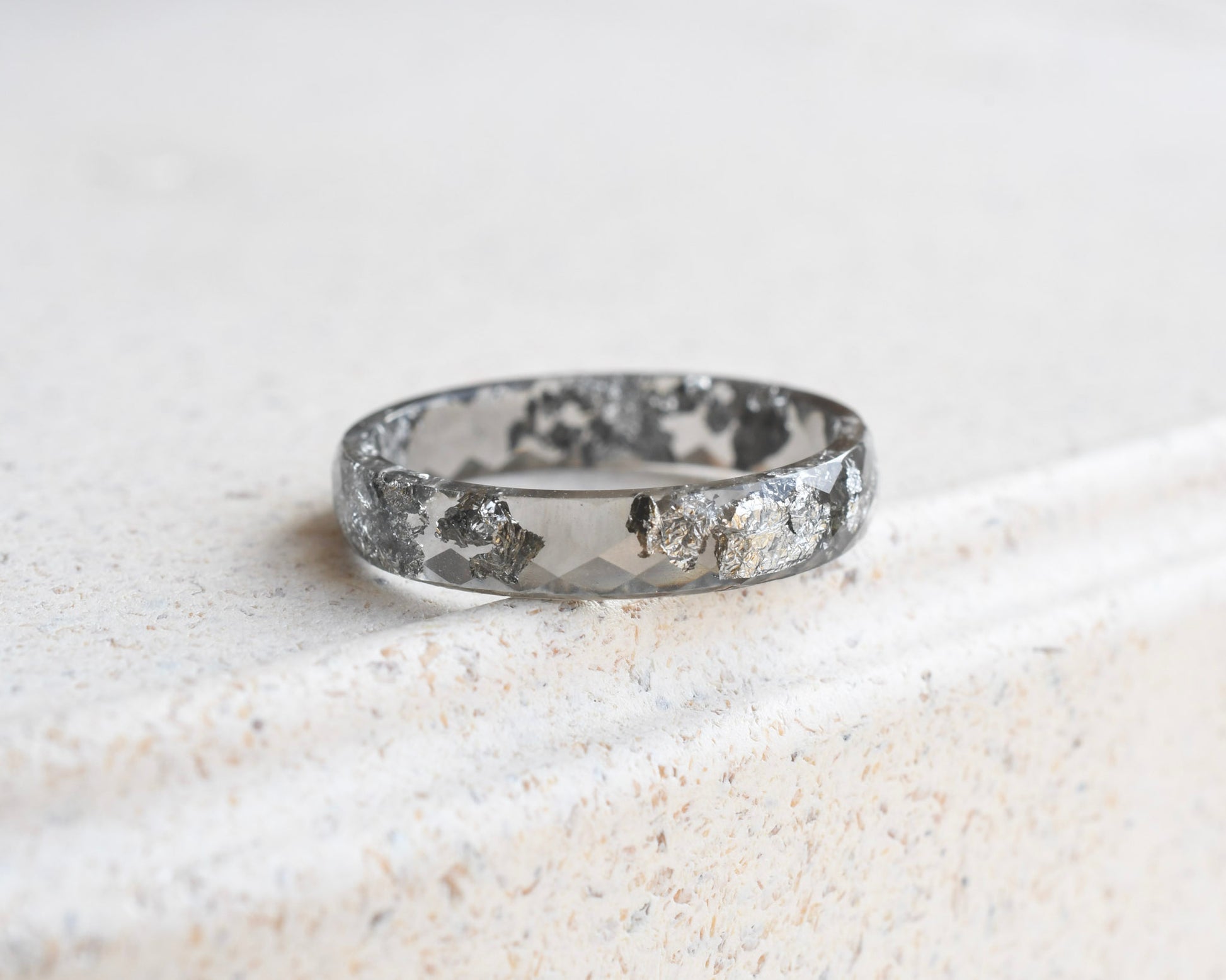 Slim faceted grey resin stacking ring with metallic silver flakes handmade in Vienna
