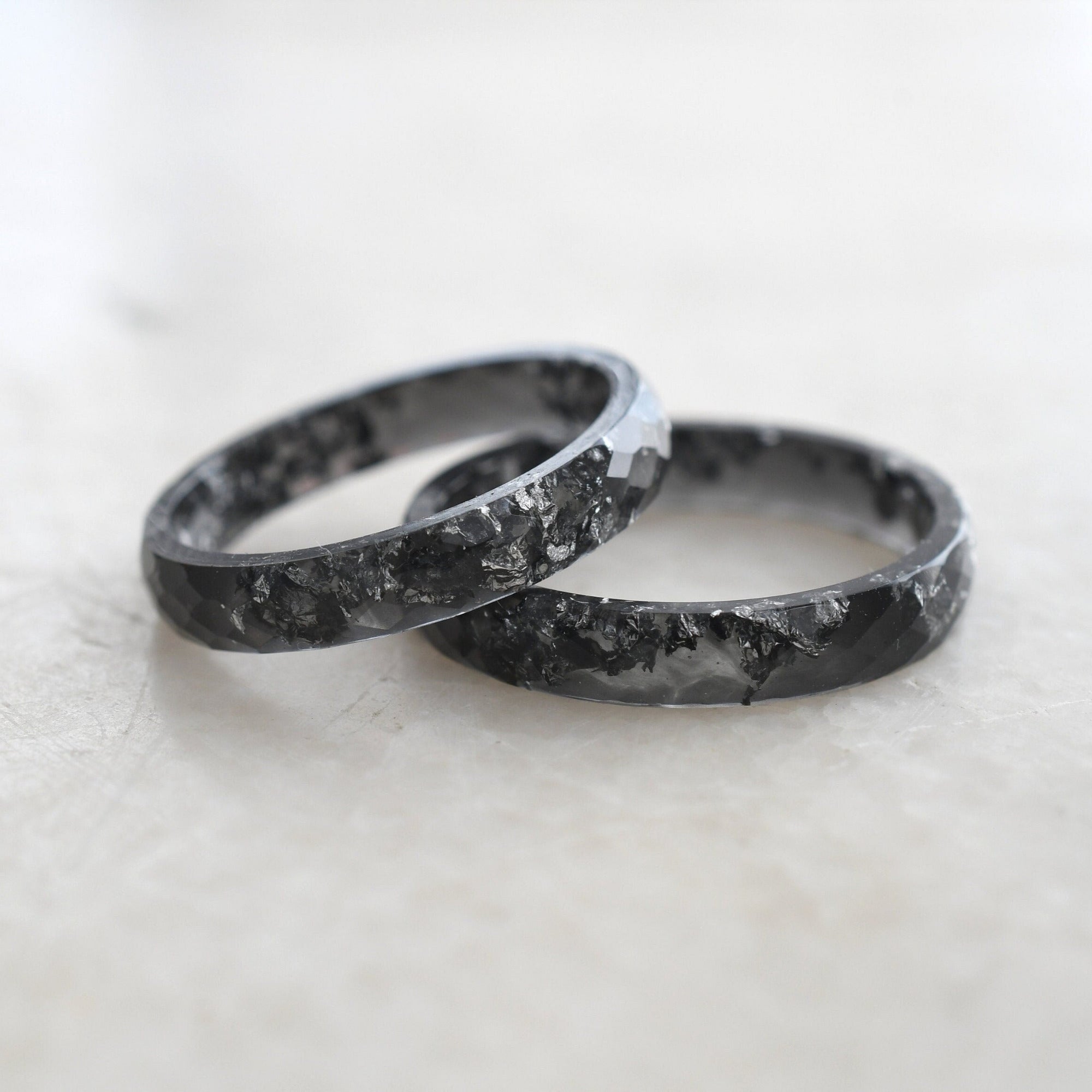 Faceted black resin ring with silver leaf handmade by Resity in Vienna