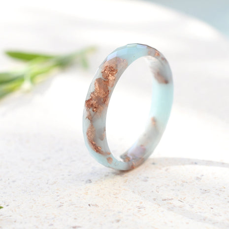Baby blue faceted resin ring with rose gold leaf handmade by Resity in Vienna
