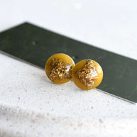 Small amber stud earrings with gold leaf — lightweight hypoallergenic handmade design