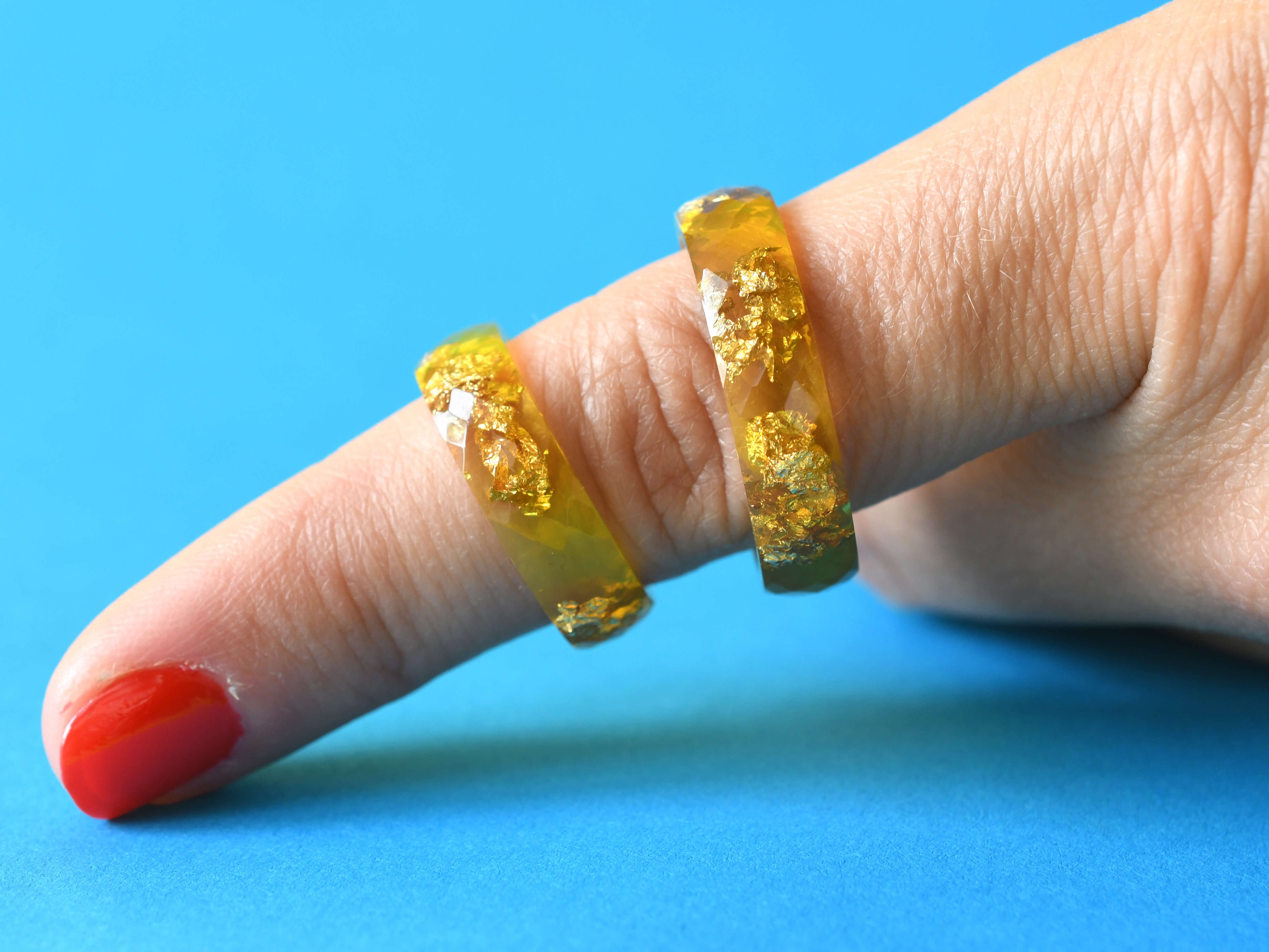 Solar Signal Ring worn on hand, capturing bold color and modern style