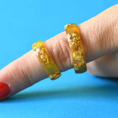 Solar Signal Ring worn on hand, capturing bold color and modern style