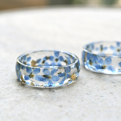 Handmade resin ring with real forget-me-not flowers and shimmering gold flakes