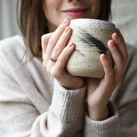 Violet Roselight Ring — thin smooth resin band with rose gold flakes on hand, that holds a mug. handcrafted in Austria