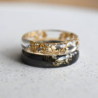 Smooth resin rings in transparent and black with gold leaf accents
