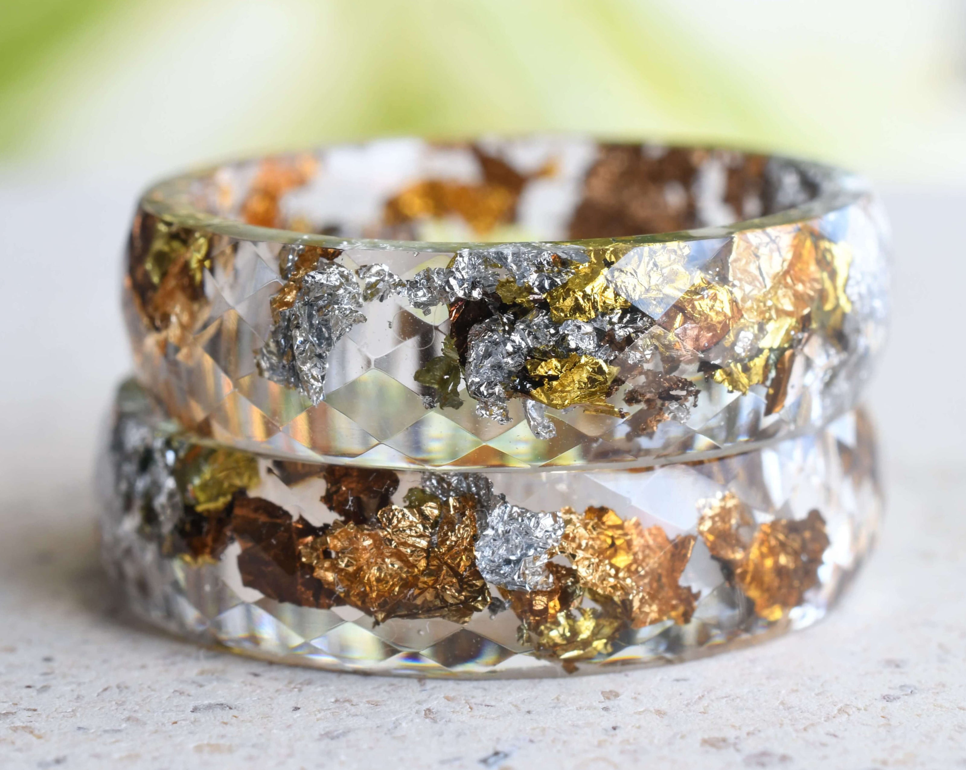 Transparent resin ring with mixed metallic flakes handmade by Resity in Vienna