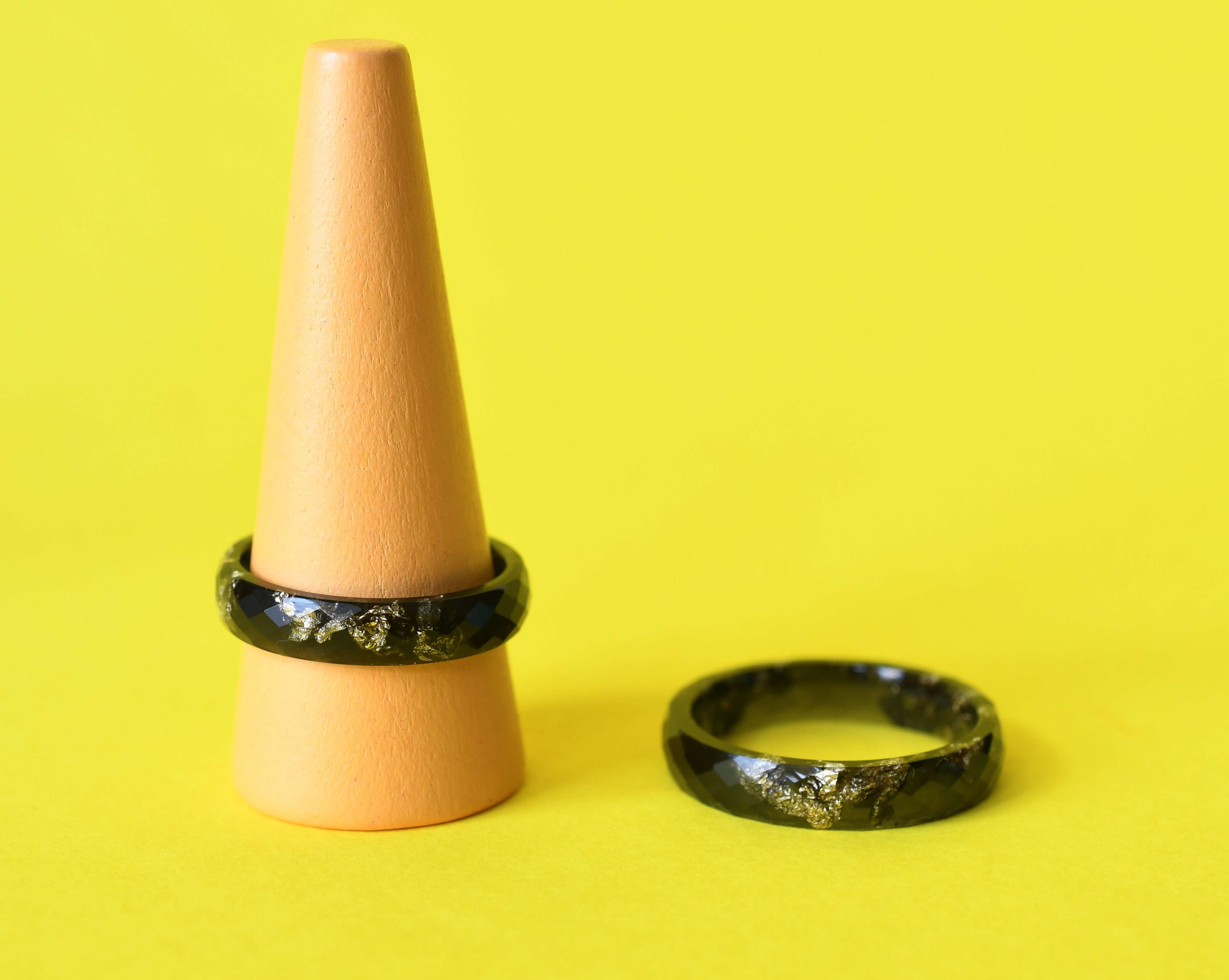 Unisex black resin ring with elegant gold accents