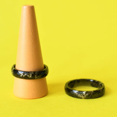 Unisex black resin ring with elegant gold accents