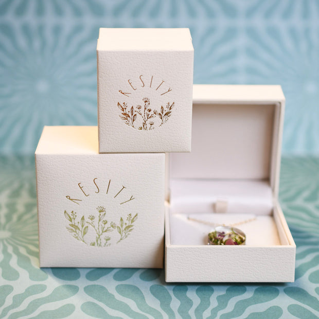 Cream vegan leather jewelry box — minimalist premium gift packaging