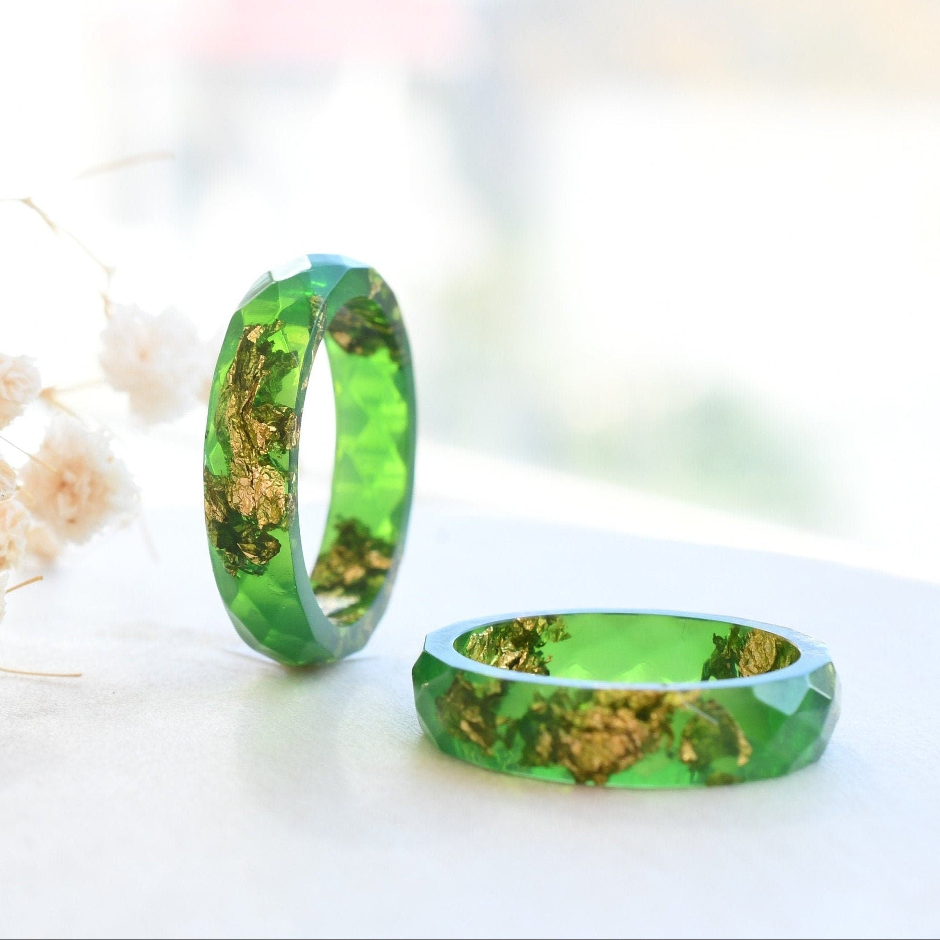 Bright green resin ring with gold flakes handmade by Resity in Vienna