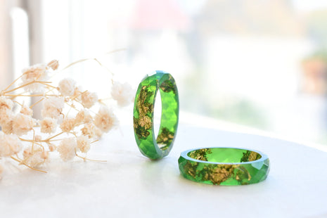 Bright green resin ring with gold flakes handmade by Resity in Vienna