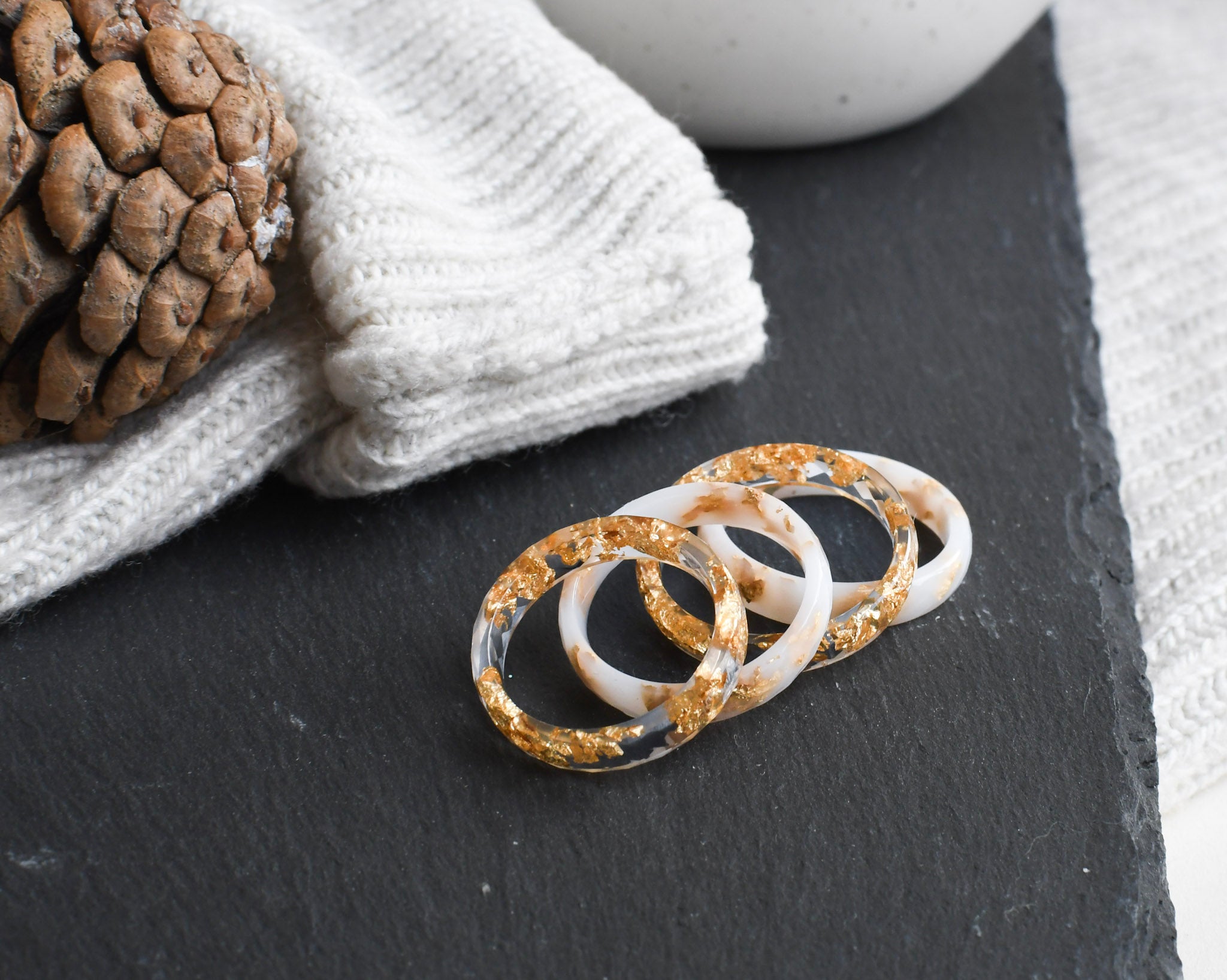 White and transparent stacking resin rings with gold flakes — European artisan jewelry