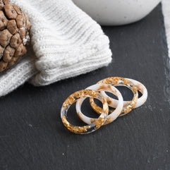 White and transparent stacking resin rings with gold flakes — European artisan jewelry