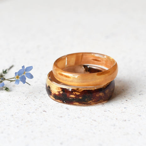 Matching his and hers resin rings with real birch wood, handmade by Resity in Vienna