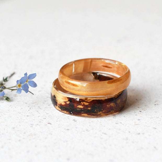 Matching his and hers resin rings with real birch wood, handmade by Resity in Vienna