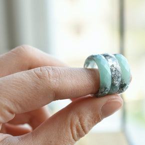 Silvermist Bloom Ring held in hand