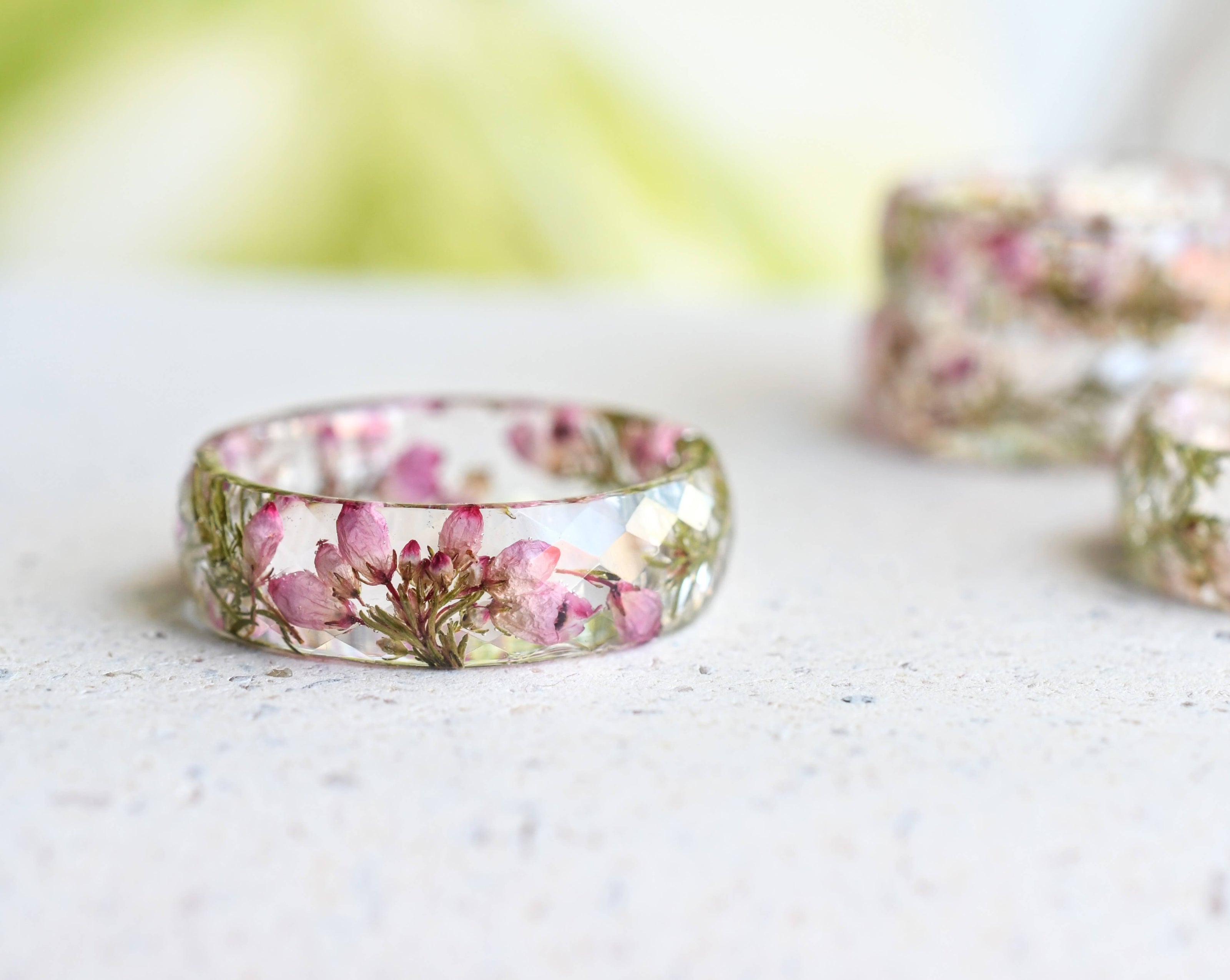 Flatlay of handmade botanical resin ring