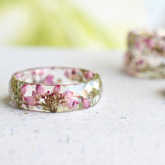 Flatlay of handmade botanical resin ring