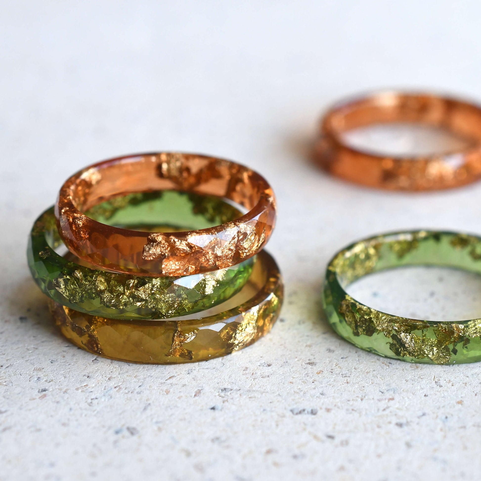 Handmade amber resin ring with real gold leaf — minimalist faceted jewelry crafted in Vienna by Resity