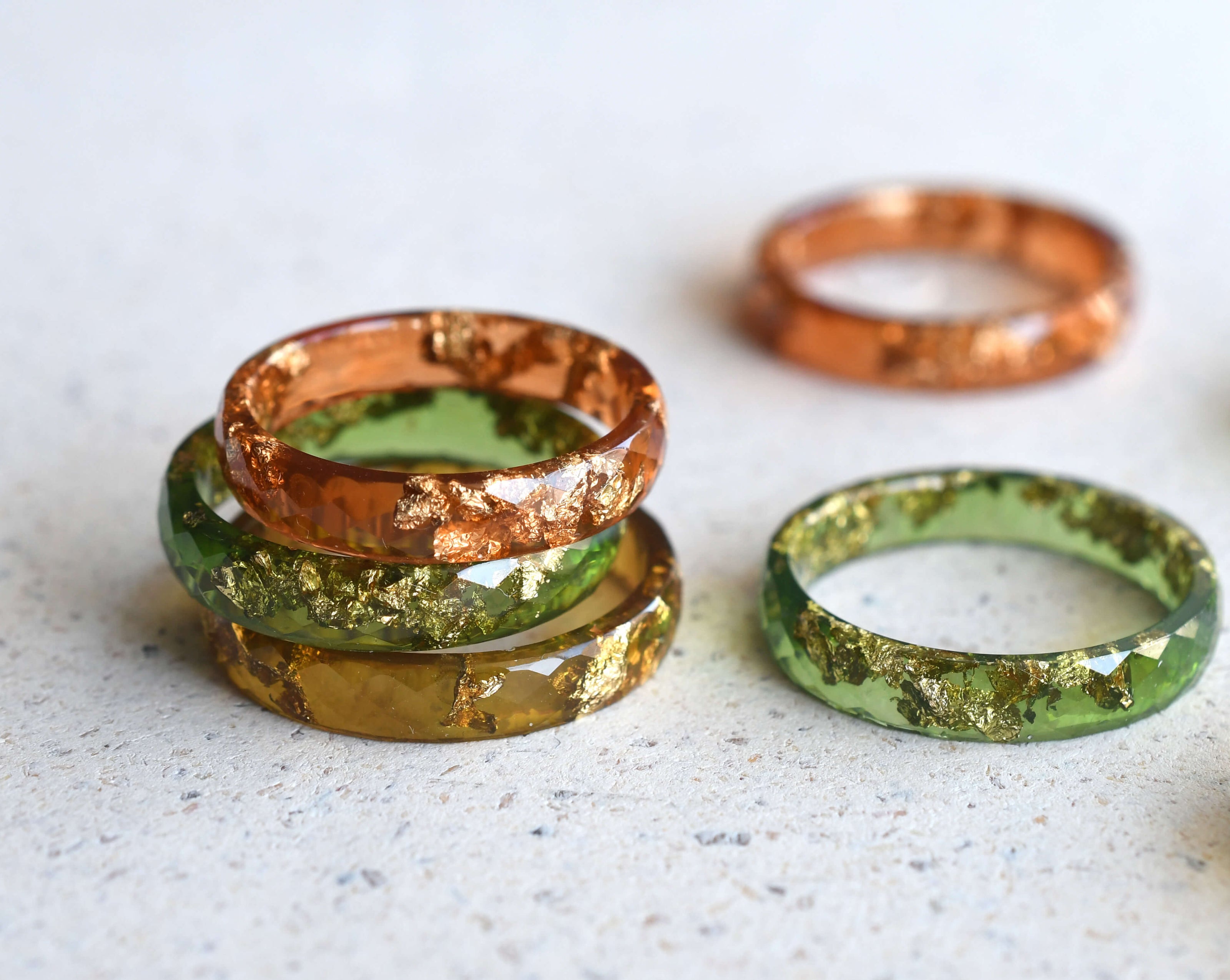 Handmade amber resin ring with real gold leaf — minimalist faceted jewelry crafted in Vienna by Resity