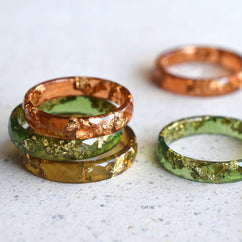 Handmade amber resin ring with real gold leaf — minimalist faceted jewelry crafted in Vienna by Resity