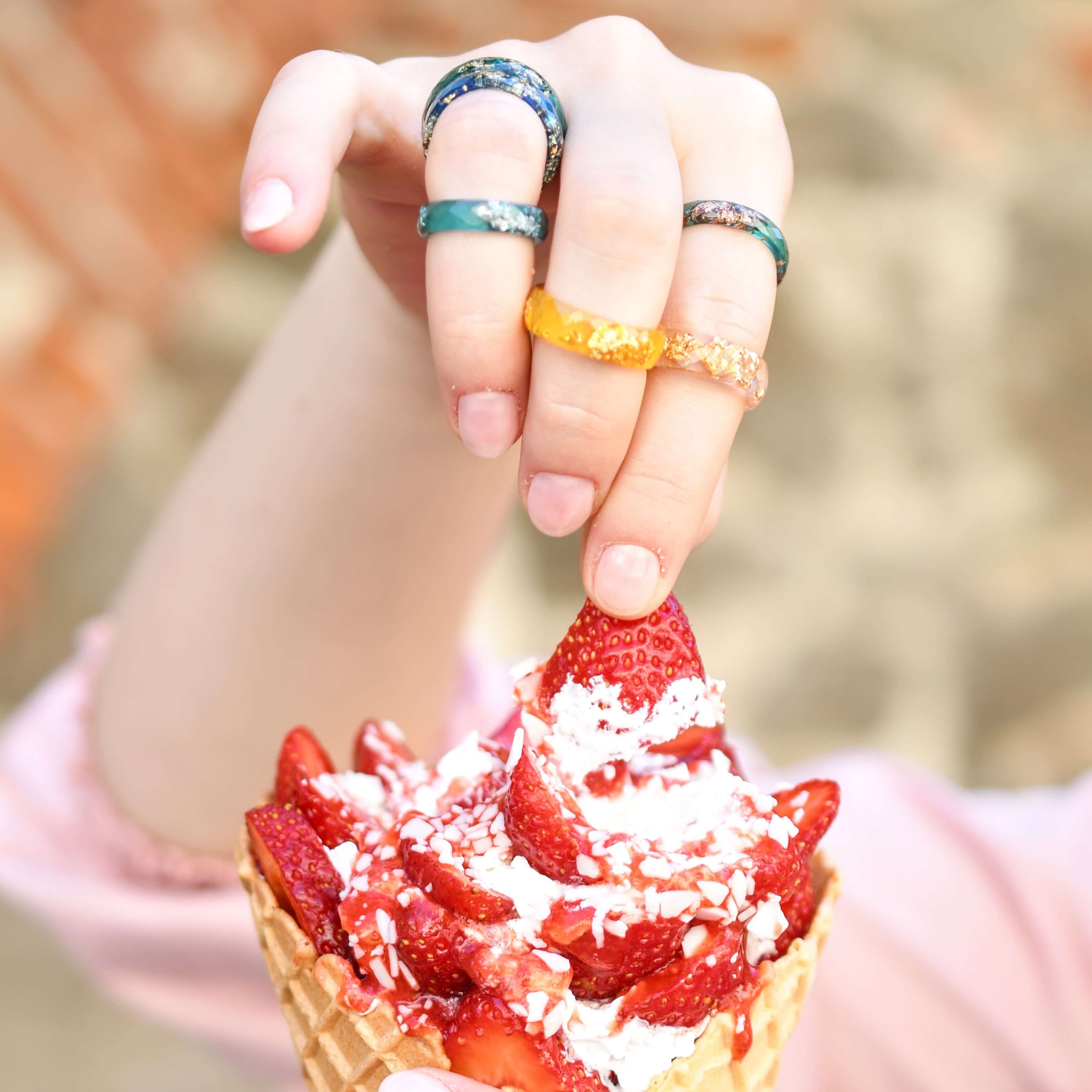 Close-up of thin jade green resin ring with subtle rose gold shimmer