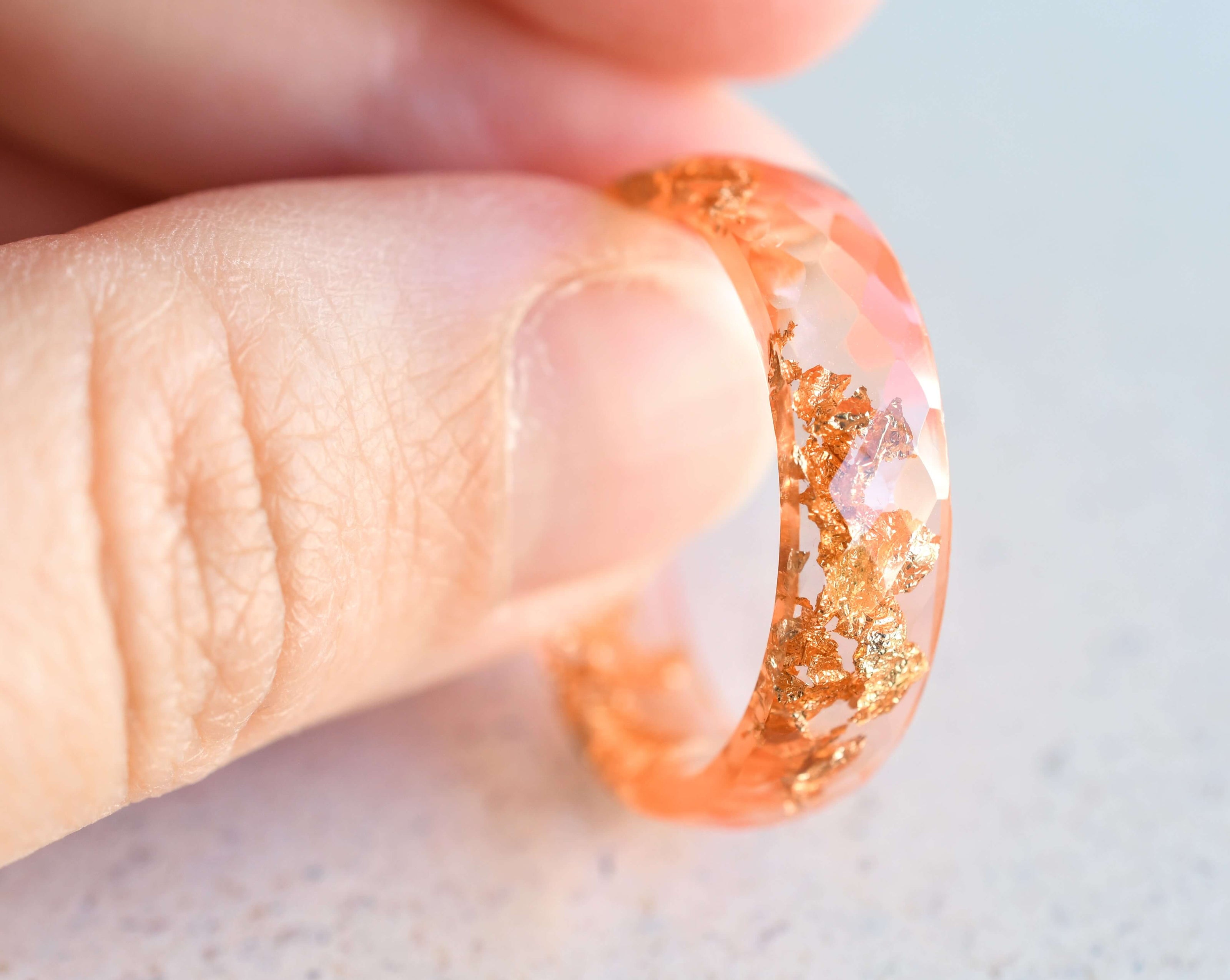 Coral Glow Ring — wide coral resin ring with gold leaf detail, handmade modern jewelry from Vienna