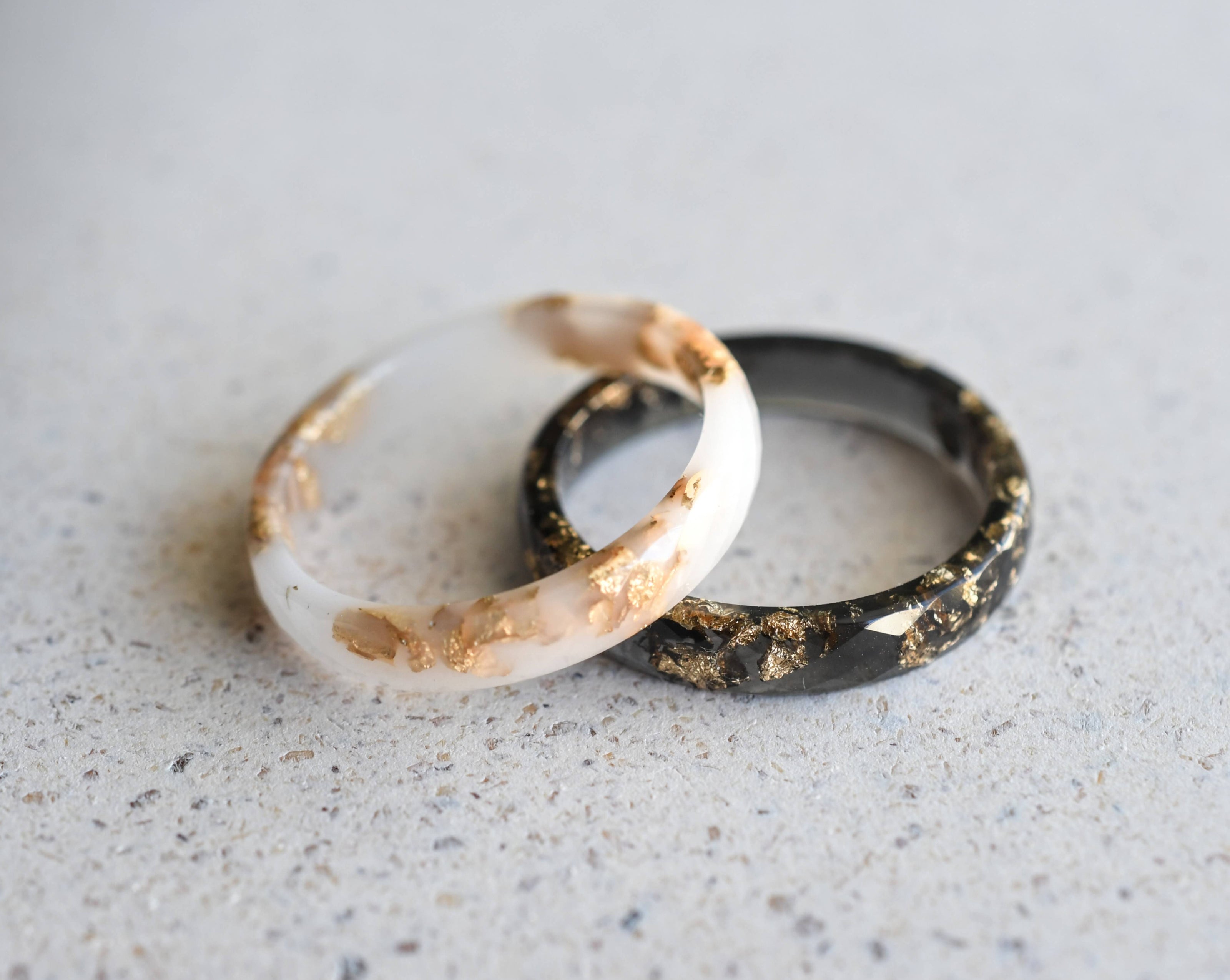 Faceted black and white resin ring bands — handcrafted unisex jewelry from Austria