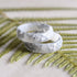 White resin ring with silver flakes handmade by Resity in Vienna