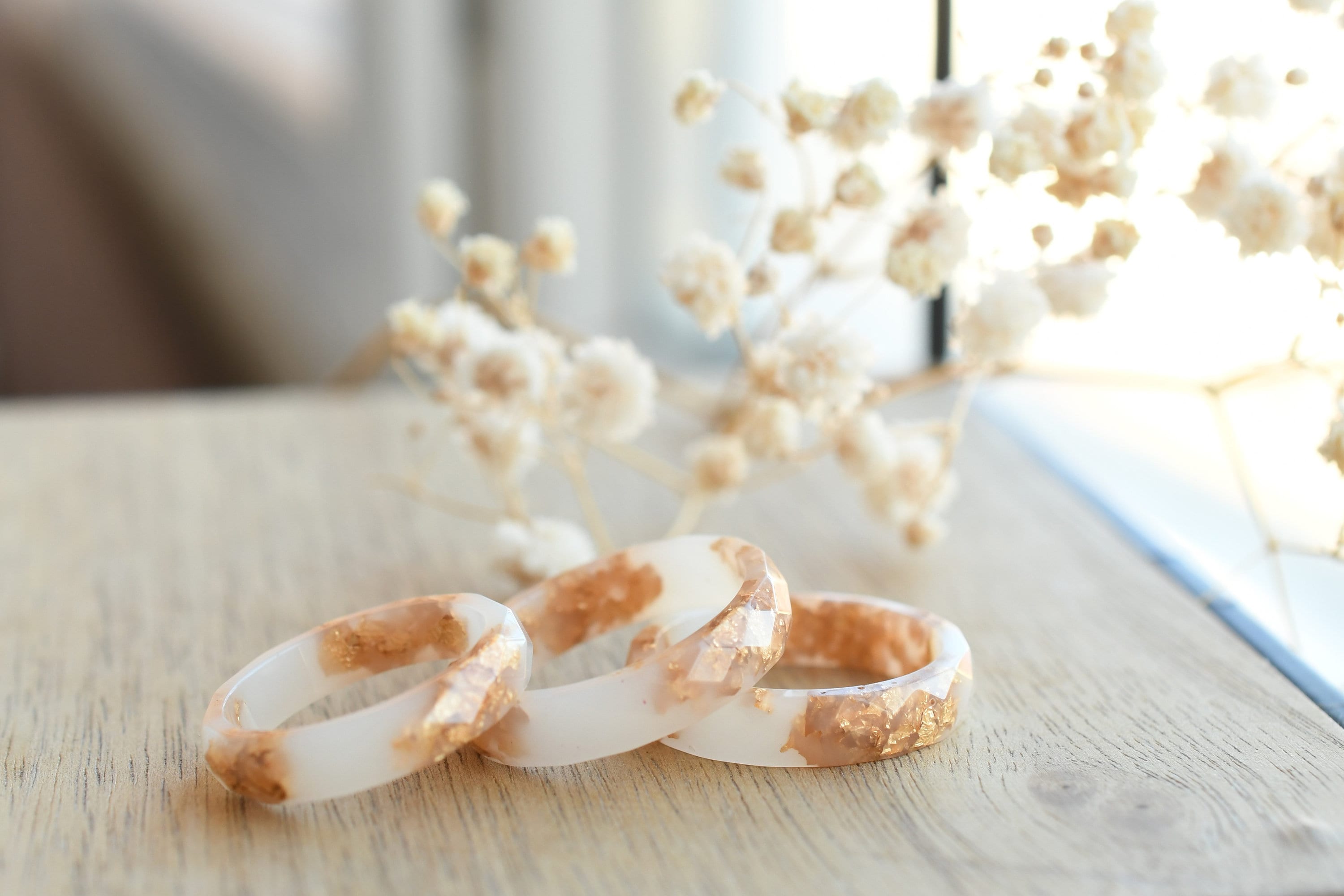 White resin ring with gold flakes handmade by Resity in Vienna