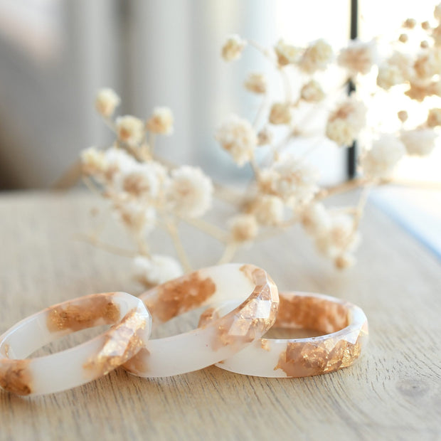 White resin ring with gold flakes handmade by Resity in Vienna