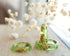 Close-up of real gold flakes suspended in light green resin handmade ring