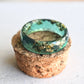 green ring with gold leaf