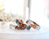 Faceted grey and clear resin ring with shimmering rose gold flakes — handmade jewelry