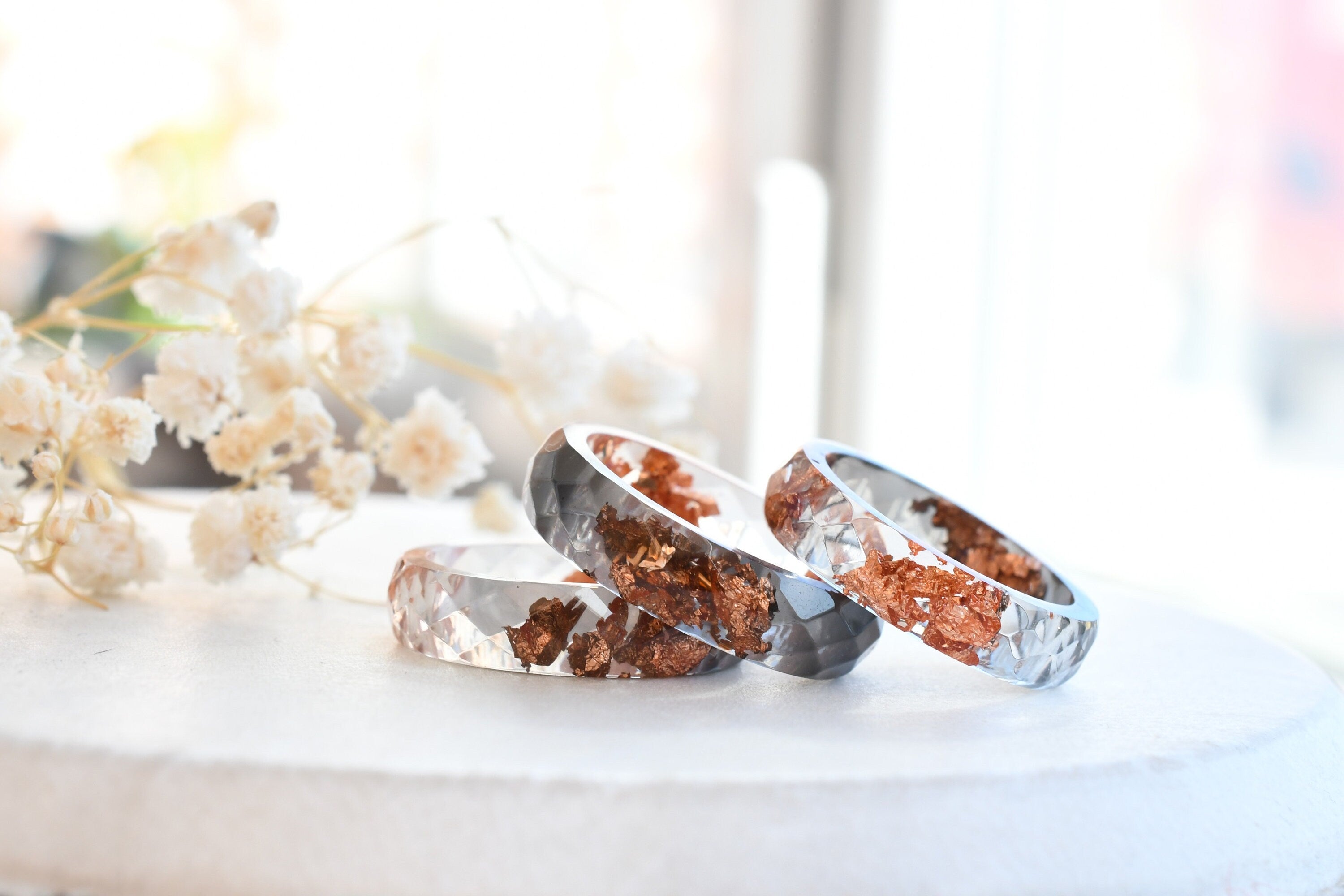 Faceted grey and clear resin ring with shimmering rose gold flakes — handmade jewelry