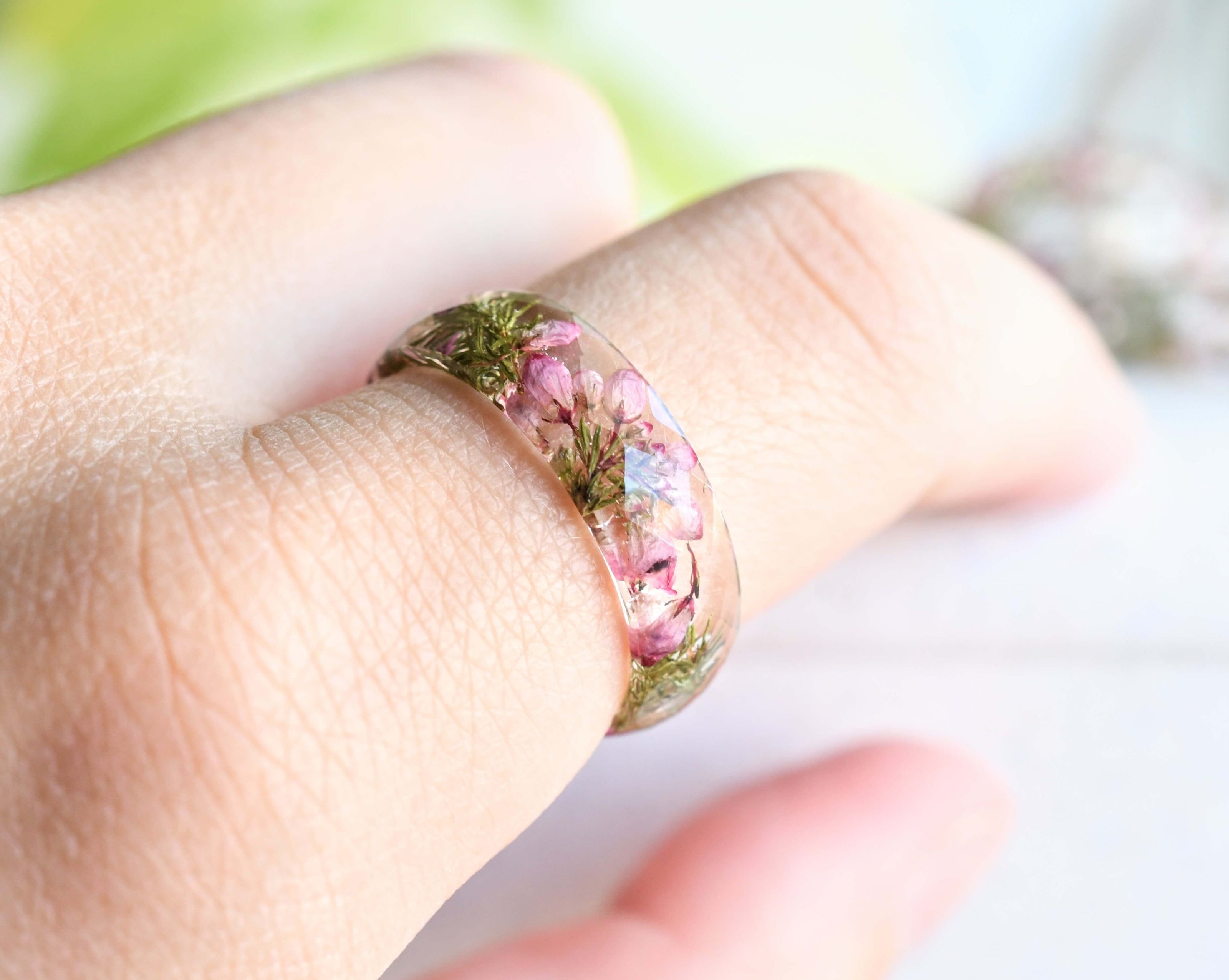 Heather flower resin ring worn on hand