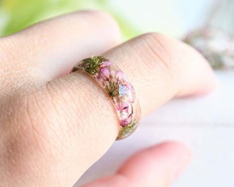 Heather flower resin ring worn on hand