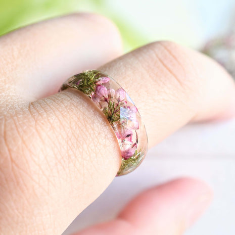 Heather flower resin ring worn on hand